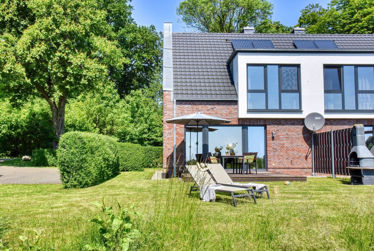 Ferienhaus Backsteinquartier B in Putbus – Sauna, Kamin und Boddenblick
